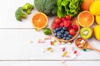 top-view-of-fresh-fruits-and-vegetables-with-different-medicine-on-a-wooden-spoon